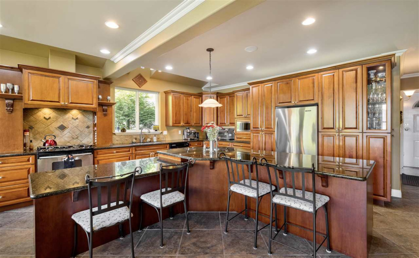 Double pantries, bakers island with granite countertops