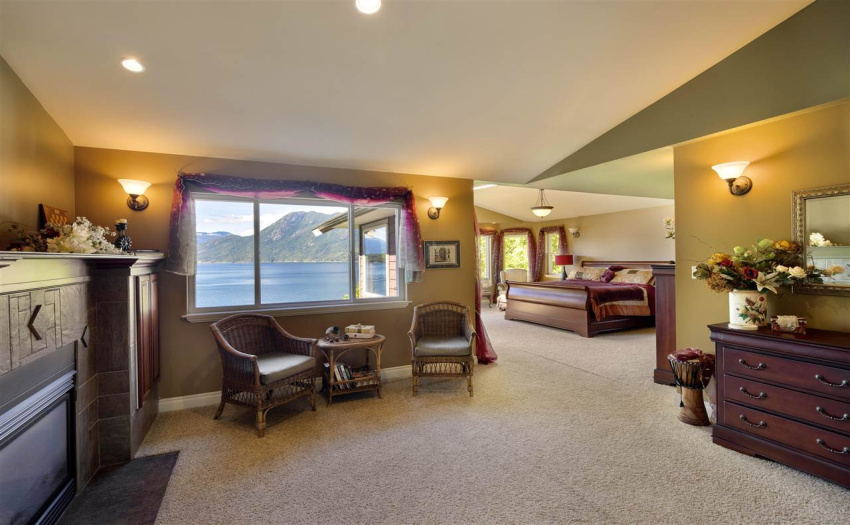 Sitting and reading areas are within the 1000 sqft master bedroom with a cozy double-sided fireplace