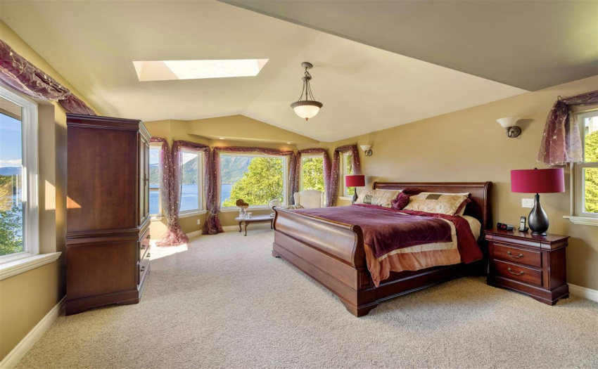 Stunning master bedroom with breathtaking inlet views