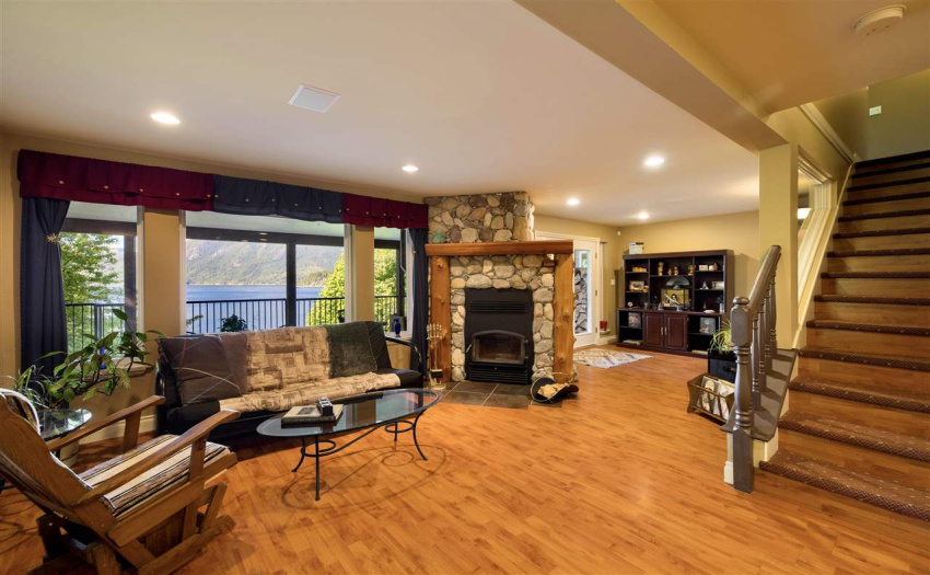 Ground floor family room with wood burning fireplace. There is potential for an in-law suite at this level.