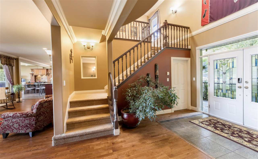Grand front entrance with double glass stained doors