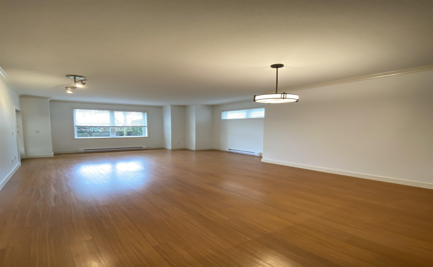 View showing spacious living room area.