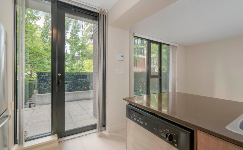 Kitchen & Private Patio In The Back Of The Townhome Facing A Park & Playground