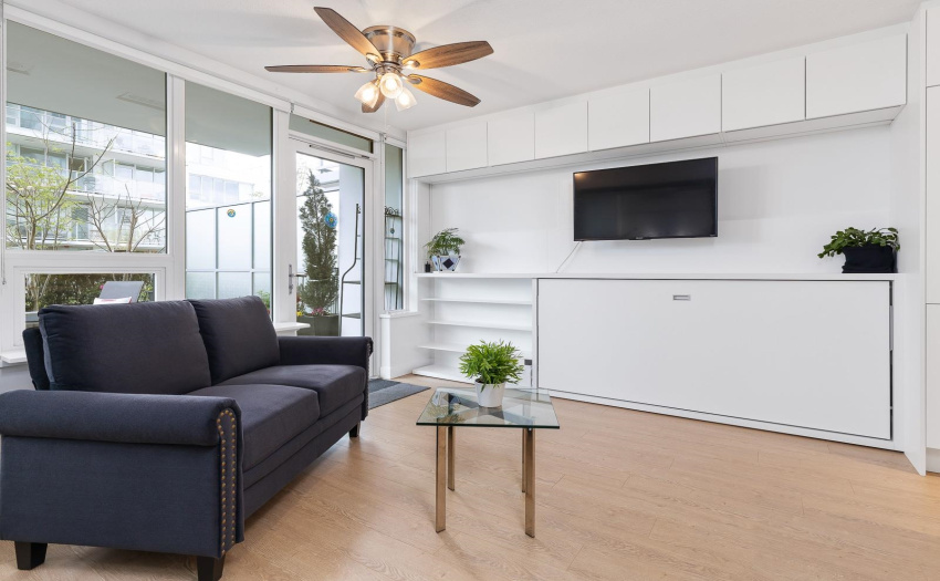 Welcoming open layout, Queen Murphy w/privacy curtain, open area concept and a built-in guest twin bed. Functional extendable table, seat 2 to 9 guests. Includes loveseat, TV, 2 mirrors, custom built cabinets, MOVE IN ready.