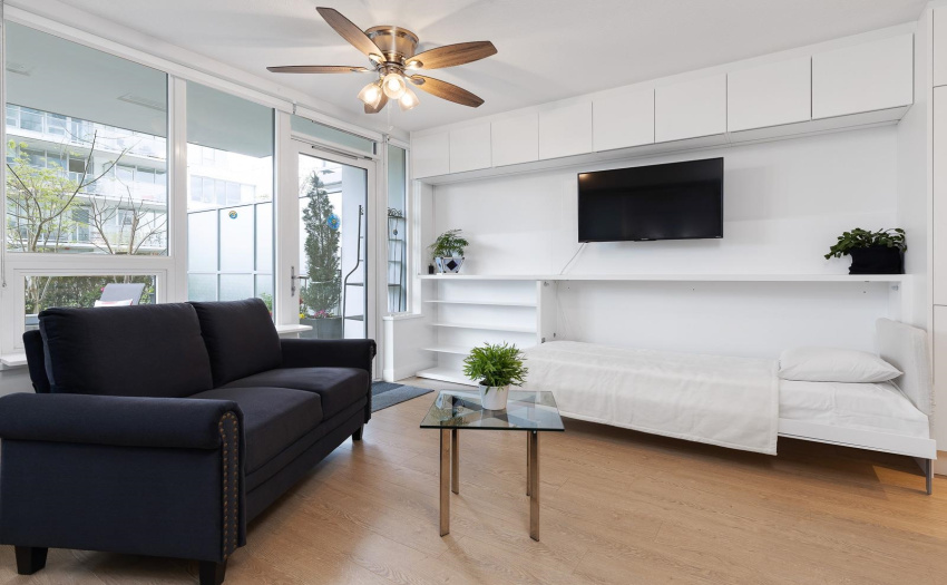 Welcoming open layout, Queen Murphy w/privacy curtain, open area concept and a built-in guest twin bed.  No need to buy beds, all included in the price.  Saves you buying furniture.