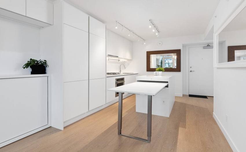 Kitchen Table is extendable to 15 feet.  2 to 9 guests can dine or work or play today.  No need to buy a dining table, it is included in this smart home.