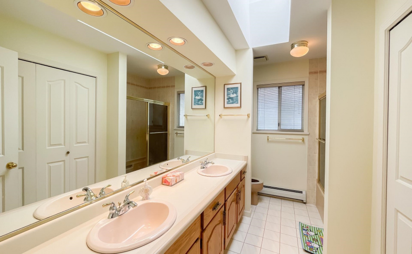 Bathroom with double sink & storage space