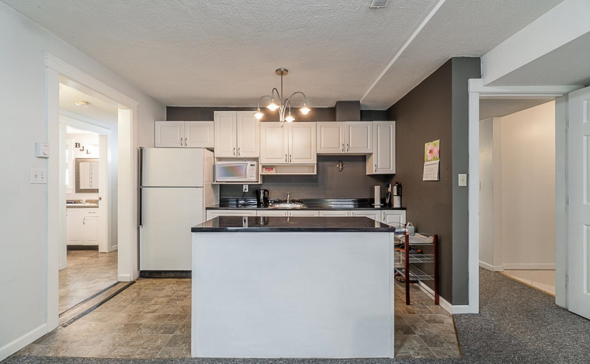 Wiring for a stove and hood fan are behind the cabinets