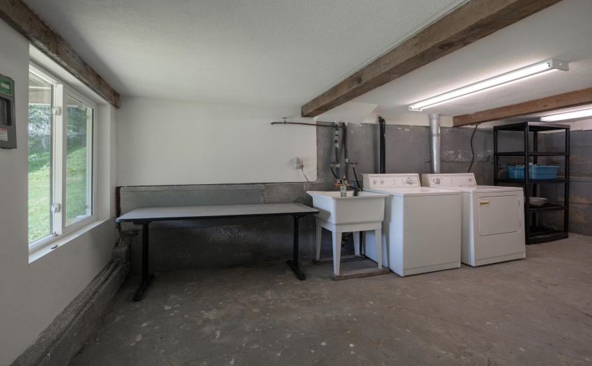 Laundry area in lower floor of cottage