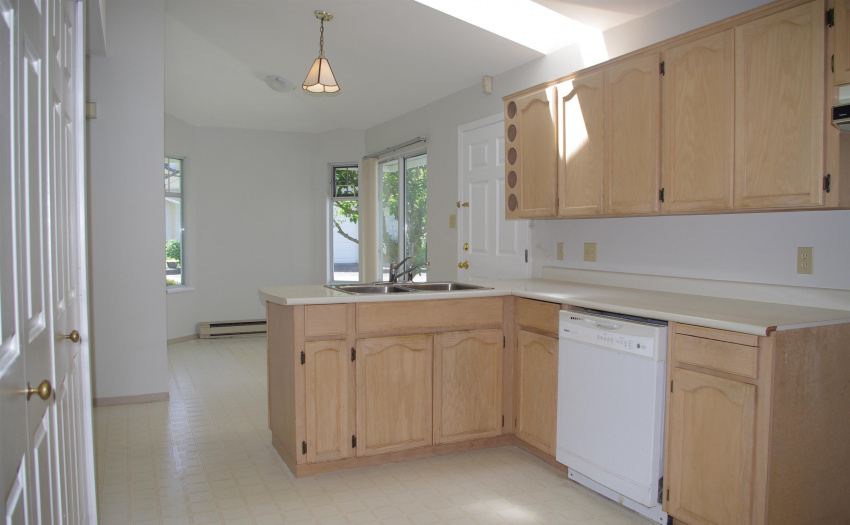 Breakfast nook has a sliding glass door opening to a private dining patio.