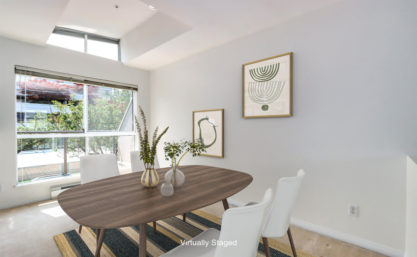 Bright Dining Room with cathedral ceiling
