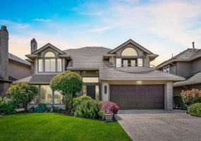 Beautiful landscaped front yard and main entry.