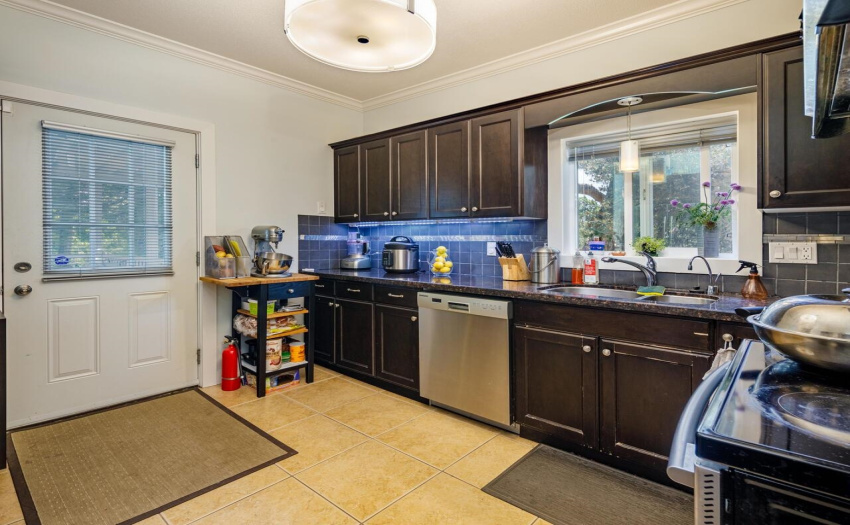 Kitchen renovated in 2010. With granite countertops, custom solid wood cabinetry.