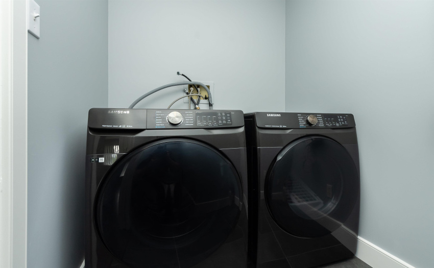 has new Samsung full size front load washer & dryer and loads of storage space.