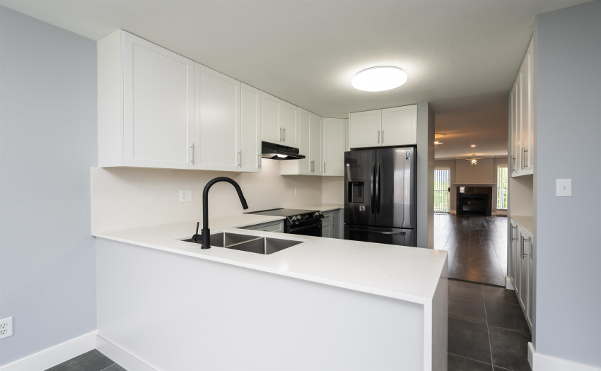 with new Quartz countertops and backsplash.