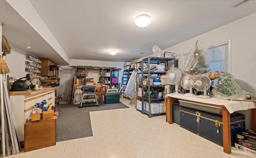 A functional flexible room, currently used for storage, but has roughed in plumbing and access to the exterior - could be another bedroom or nanny suite?