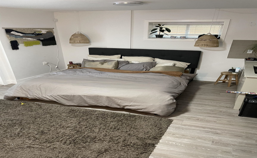 Basement Living room/recreation room, but the tenant is using it as their main bedroom.