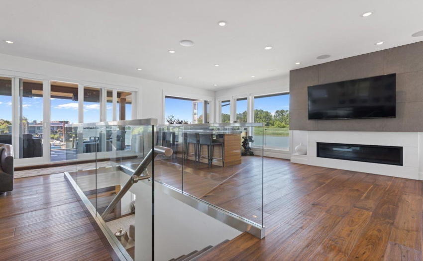 Open Concept upper level with large Family Room, wet bar, fireplace, entertainment areas