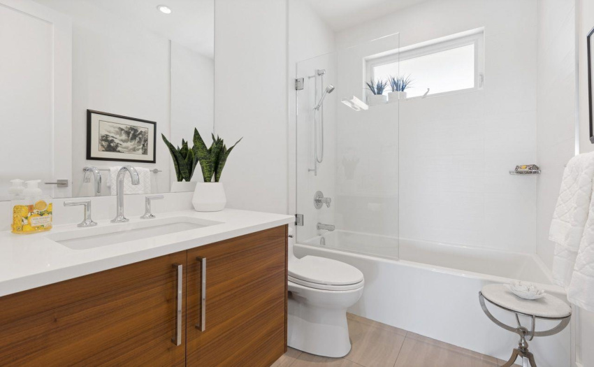 Guest Washroom on second floor with walnut cabinetry and quartz counters.