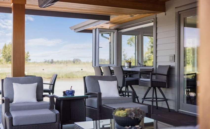 Upper deck area has seating area as well as seating at the  bar with an accordion folding window for easy serving of your guests.