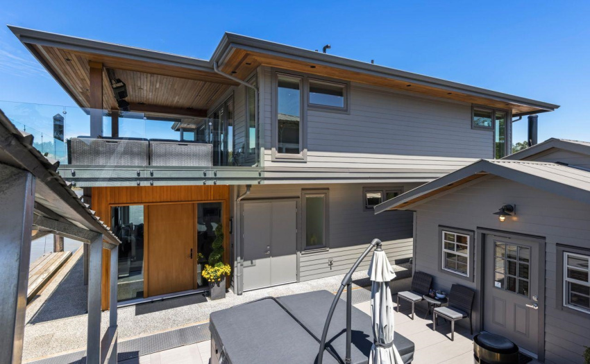 Stroll down the Covered illuminated ramp to your custom float home, entertainment area and boat slip access.
