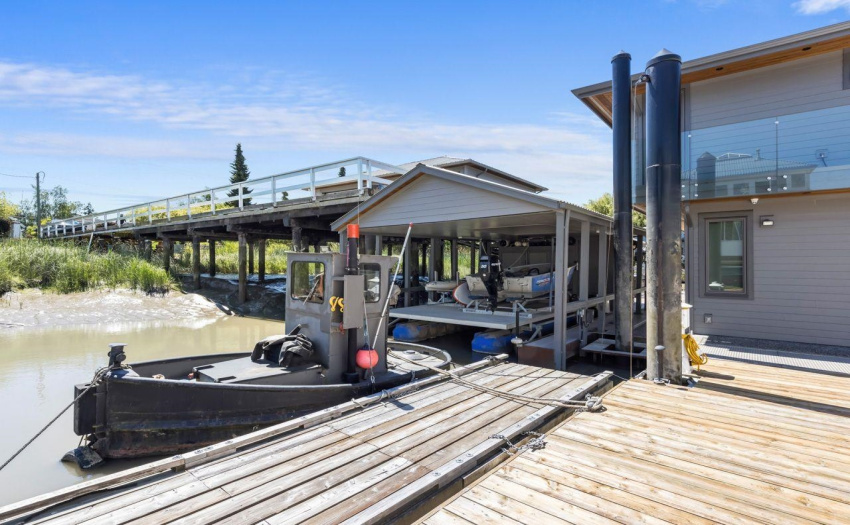 Covered Boat Lift with extra storage capacity behind storage shed area for all those boat items you have.