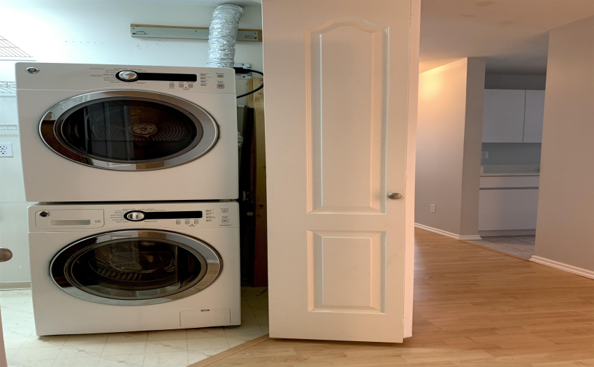 FULL SIZE WASHER AND DRYER. SPACIOUS STORAGE NEXT TO. BIG ENOUGH TO HANG YOUR BIKE.