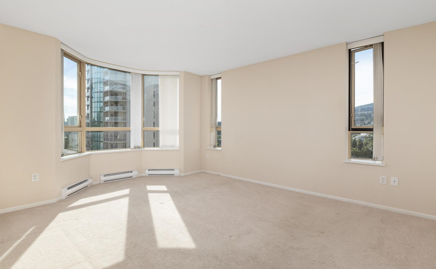 A king-size bed with night tables and dresser can easily fit here.