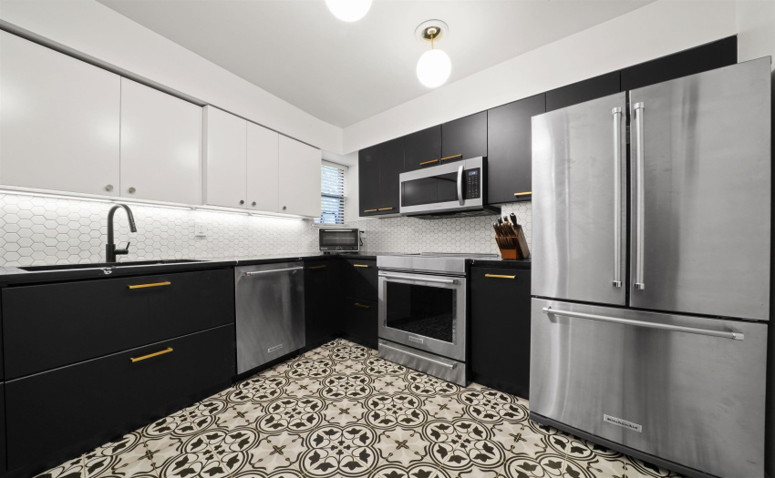 Induction stovetop, Kitchen Aid stainless steel appliance package, Nuheat radiant floor heating, quartz countertops, nesting drawers & more