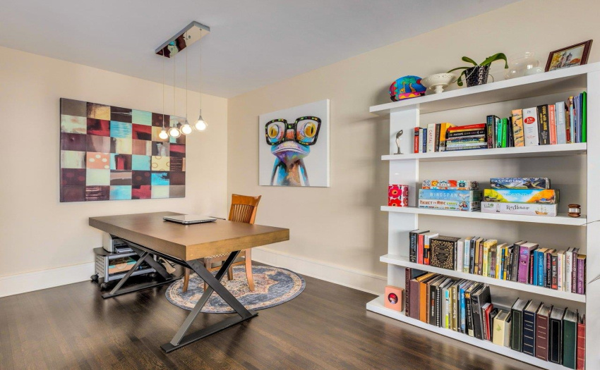 The owners have been using the dining area as an office. The living area easily accommodates a dining table.