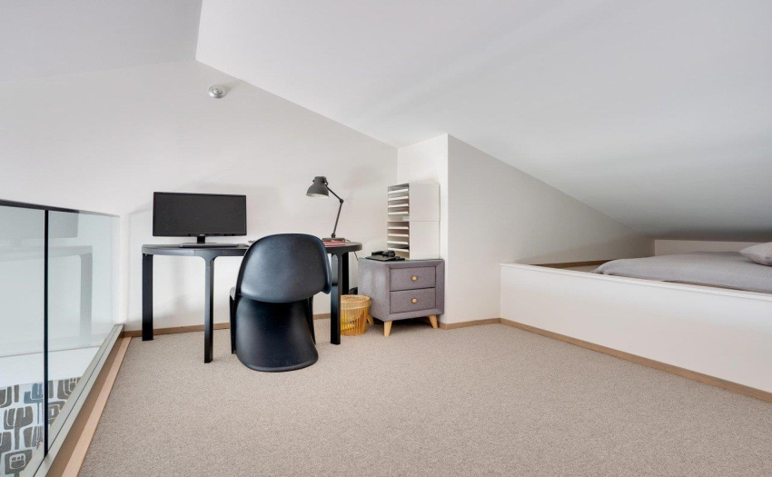 Open to the main floor, airy and light-filled