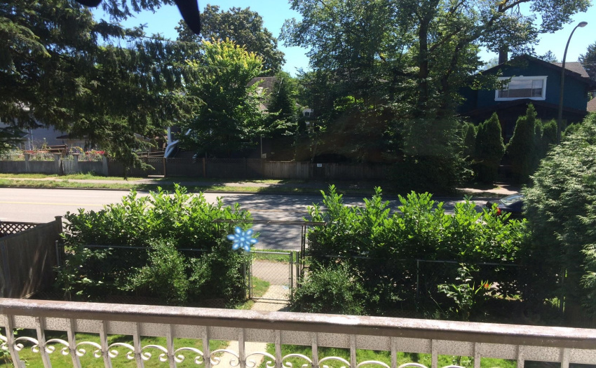Looking south from the living room sliding glass door across 12th Avenue.