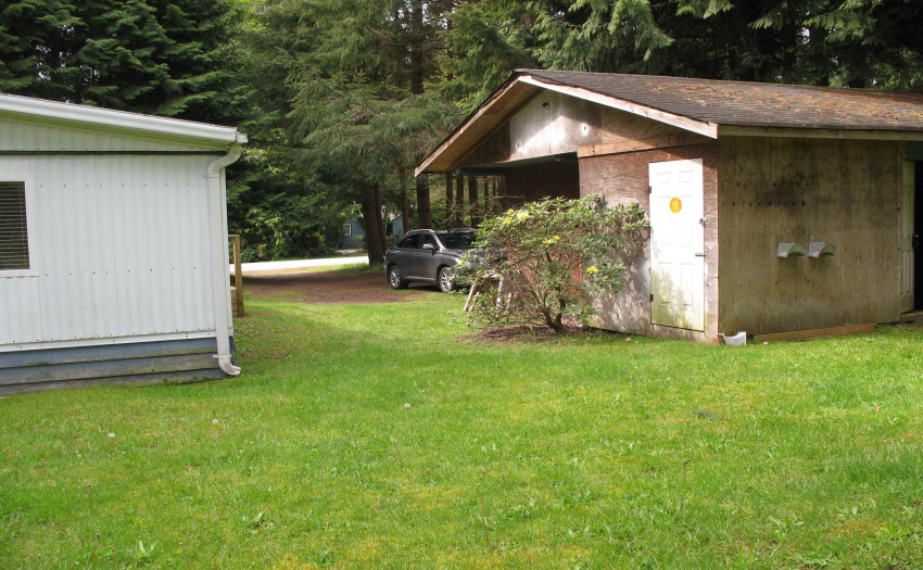 View of the garage exterior.  New garage door opener.