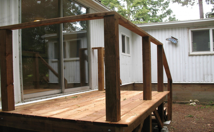 New deck off dining room patio doors - with stairs to access the property.