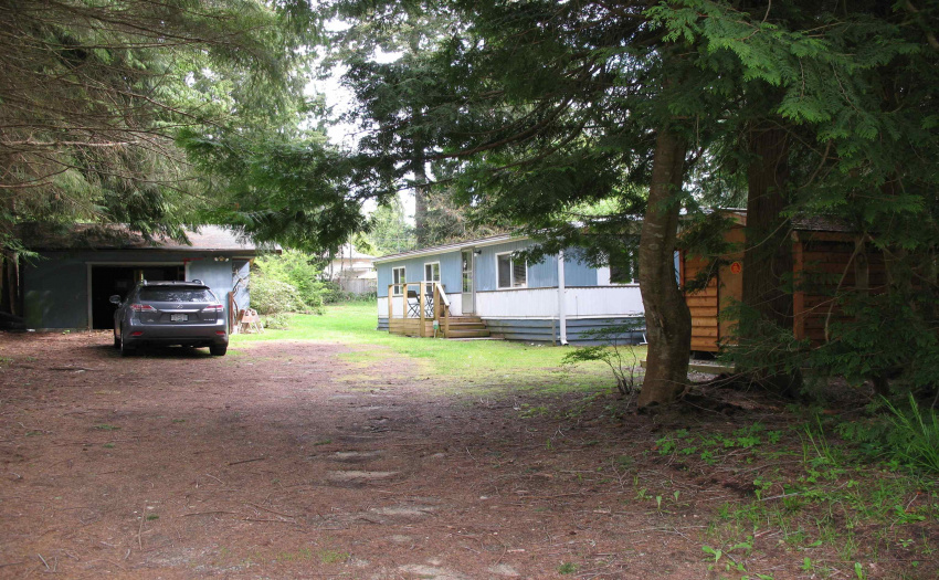 Set back from the road - this home is private from the road.  Large trees buffer you from cars and people.