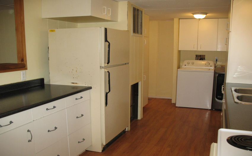 View through to the laundry area - right off the kitchen.  to the right is an addition with a separate sink and door that provides access to another deck and the backyard.