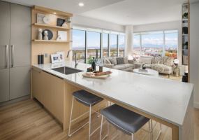 An abundance of smart storage and drawer space, alongside quartz countertops, offer a polished look and finish.