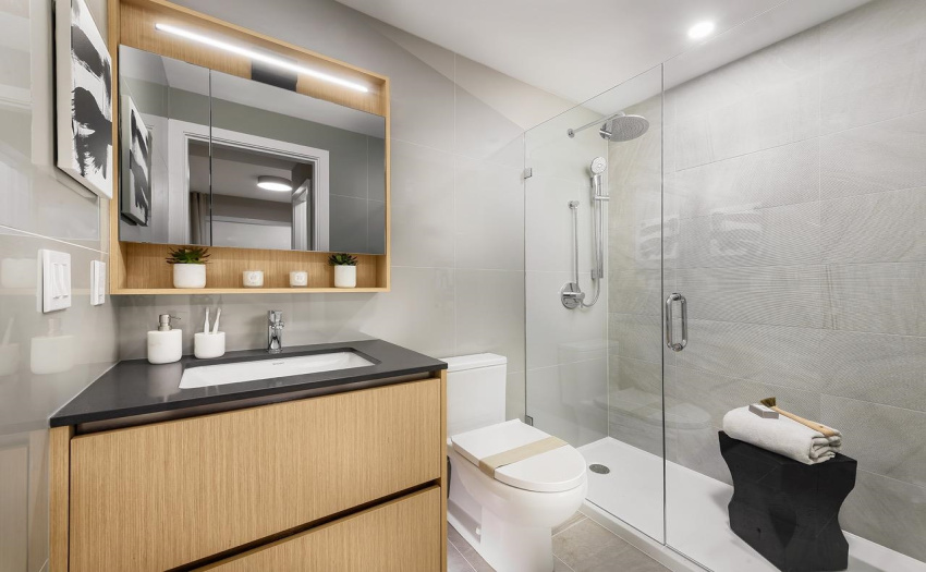 Elegant, frameless glass shower with rain shower head