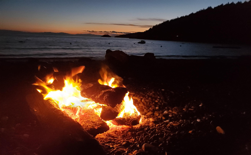 Beach fire on West Beach in the winter time. 5 min walk to the property. Keats Island is a year round community