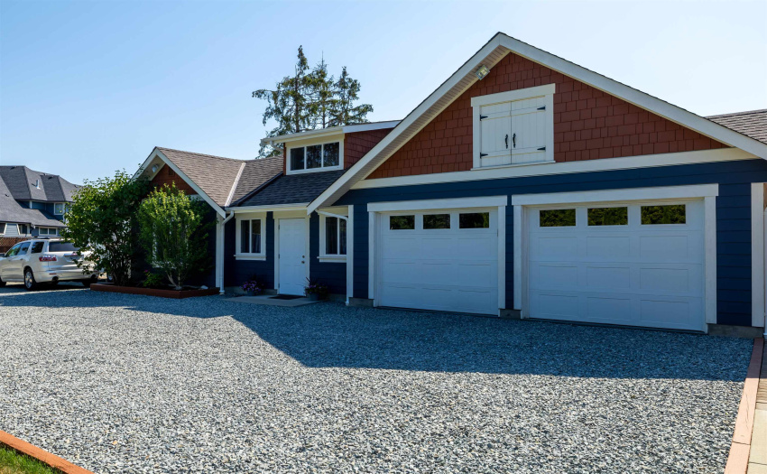 2 car garage & entry to the coach house. Loft above the garage for additional storage.