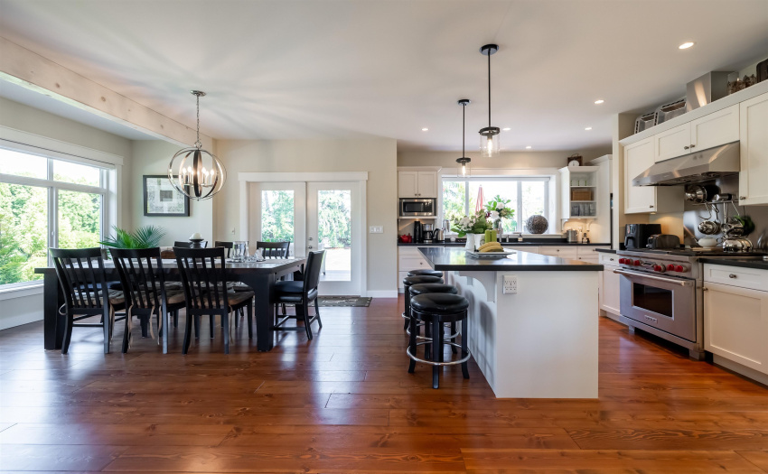 A great space for family as well as entertaining (note the Wolf gas range) with access via french doors to a beautiful covered outdoor area.