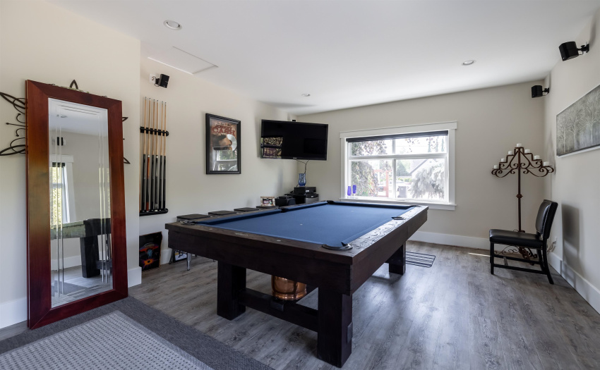 Rec room off the kitchen/dining area with access to the back yard.