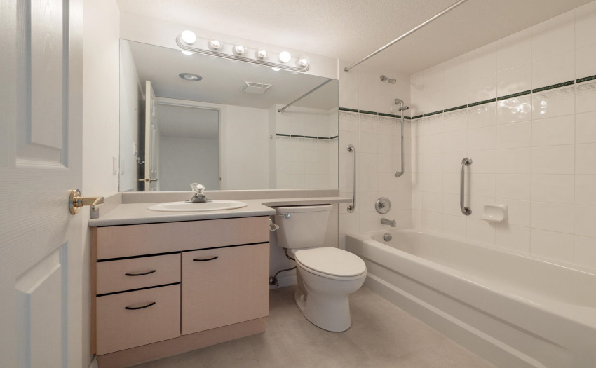 With large tub and tiled surround.