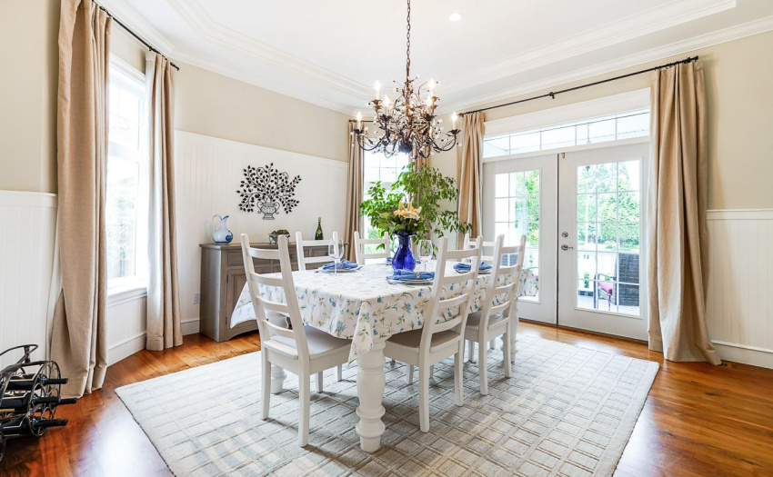 French doors from the dining room lead to covered, front porch