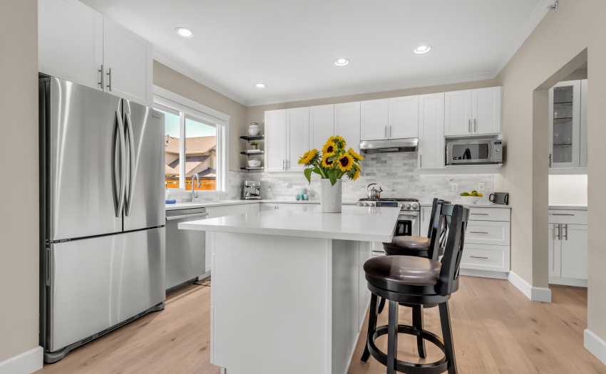 Bright & spacious with a large island and gas stove for the chef in the family.