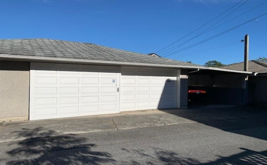Two single garage plus a single carport, plenty of storage space inside garage / workshop.