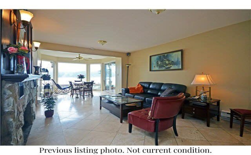 Great family room with fireplace, eating area & great view.