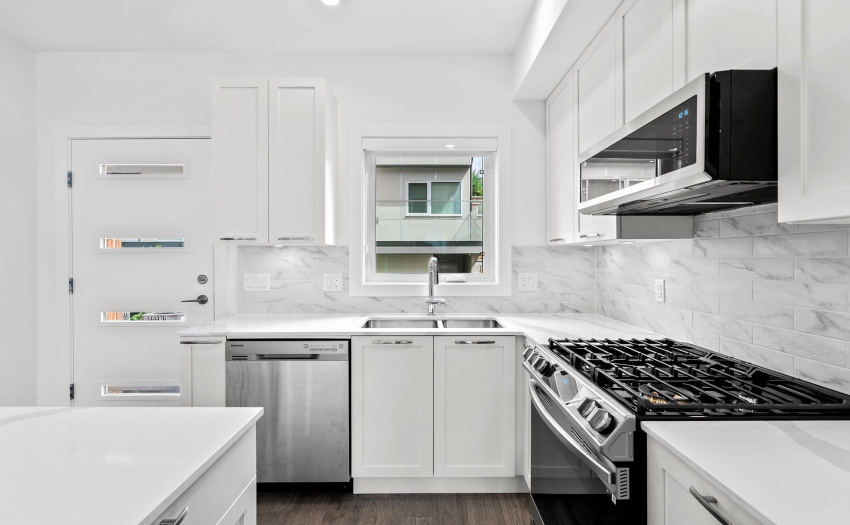 Gas stove, stone countertops, stainless appliances