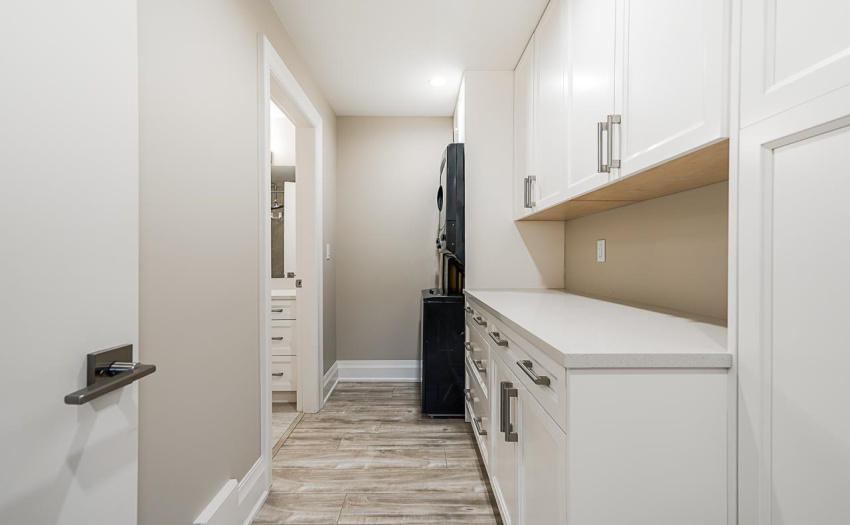 Smart built in storage and stacked laundry for legal suite.
