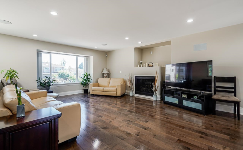 Stunning classic maple hardwood flooring, warm and inviting open floor plan with a cozy gas fireplace.